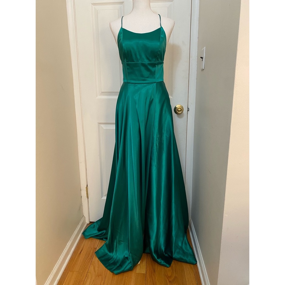Emerald green satin strappy-back gown with slit.